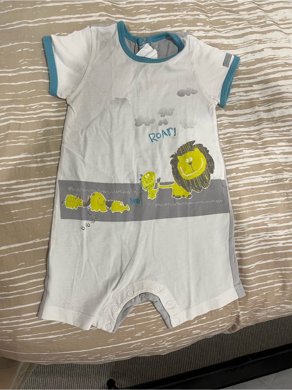 Jean Bourget White Short-Sleeve Baby Romper with Teal Trim and Yellow Lion